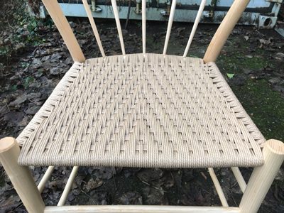 Seats are woven using natural Danish cord in a modified Irish weave pattern.