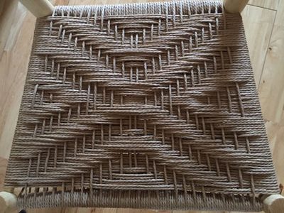 Traditional Danish Cord Twill Weaving Pattern On A Rustic Ash Chair Seat